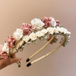 Elegant fabric flower headband with satin roses in pink and cream for women