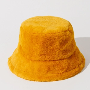 Plush yellow faux fur bucket hat for women with a minimalist solid color winter design