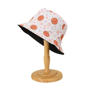 Reversible bucket hat with basketball print on white background and black lining