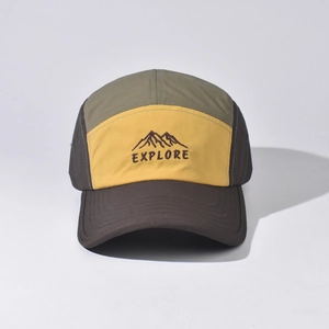 Close-up of outdoor baseball cap with mountain embroidery and EXPLORE text on front