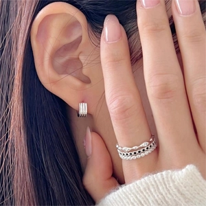 Minimalist 925 sterling silver hoop earrings and stacked ring set on model
