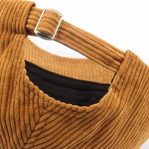 Brown corduroy baseball cap with adjustable silver metal buckle and black lining
