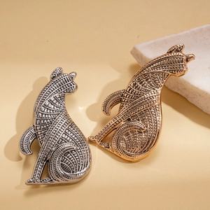 Vintage style metallic dog brooches in gold and silver finish with detailed textures