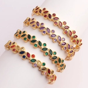 Detail view of 18K gold plated bangles with colorful marquise-cut zircon stones