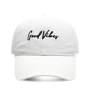 Classic white cotton baseball cap with black Good Vibes embroidery on plain background