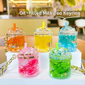 Mini liquid quicksand bubble tea cup keychains set in five vibrant colors with glitter