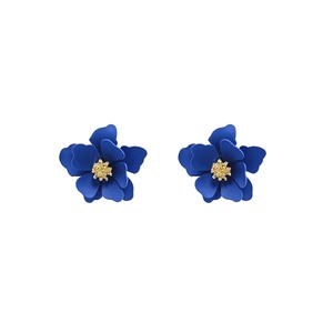 Macro detail of dark blue layered flower earrings with a golden textured center