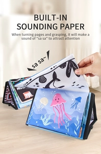 Detail of soft baby cloth book with crinkle paper and ocean jellyfish patterns