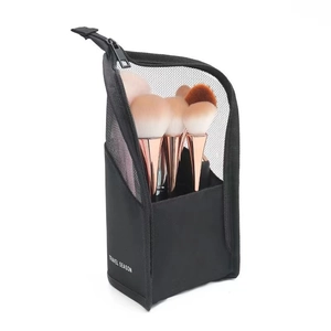 Black mesh makeup brush bag with white TRAVEL SEASON text and a sturdy zipper closure