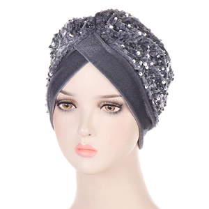 Dark grey velvet turban hat with shimmering silver sequins shown on a mannequin head