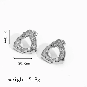 Detailed macro view of 21.3mm hammered geometric triangle stainless steel stud earrings
