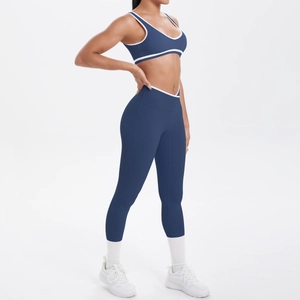 Detail der High-Waist Yoga-Leggings und Sport-BH mit weißen Kontrastpaspeln Akzenten