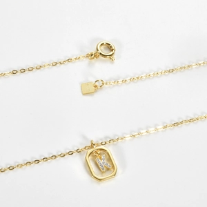 Detailed view of S925 silver gold-plated hexagon pendant necklace with letter K and zircon