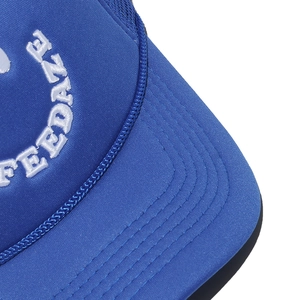 Detailed view of the FEEDAZ white embroidery on a navy blue mesh baseball cap