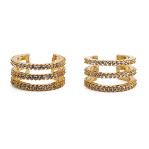 Detailed view of triple-row gold-plated ear cuffs set with shimmering clear zircon stones