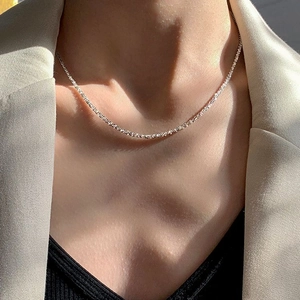 Elegant sparkling silver star necklace worn on model with minimalist light luxury style