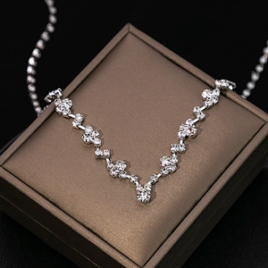 Elegant silver zircon flower bridal necklace with water drop tassels on jewelry box