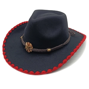 Dark blue wool felt cowboy hat with red stitched brim and braided band detail