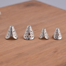 Detailed macro view of S925 sterling silver hollow conical spacer beads for DIY jewelry