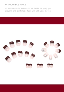Detail view of burgundy French press-on nails with silver glitter and rhinestone accents