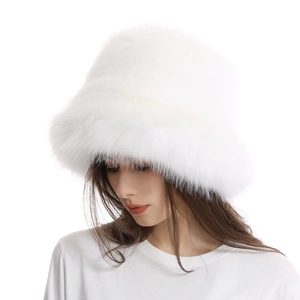 Close-up of fluffy white faux fox fur texture on a thick winter bucket hat detail