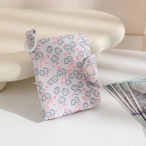 Floral fabric mini coin purse with blue flowers and snap closure for student use