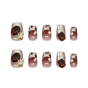 Burgundy cat eye press-on nails with sparkling diamond rhinestones and metal bow knots