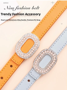 Detail of slim PU leather belts with pearl and rhinestone buckles in orange and grey-blue