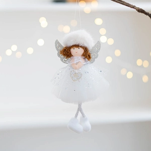 Close-up of plush Christmas angel doll with glittery mesh skirt and silver wings