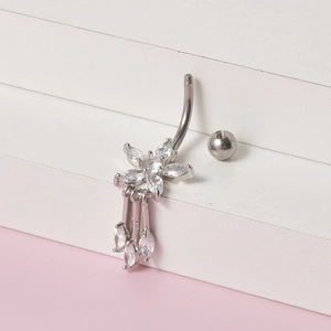 Silver belly button ring with flower-shaped clear marquise stones and tassel pendants