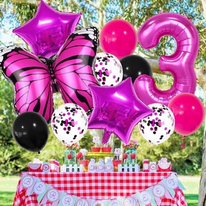 Macro detail of butterfly and number 3 balloons with berry sweet party banner