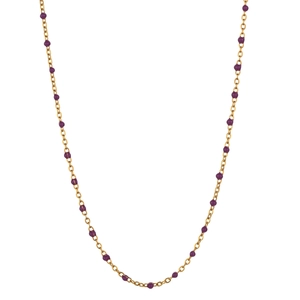 Detailed close-up of gold stainless steel necklace with small purple enamel bead accents