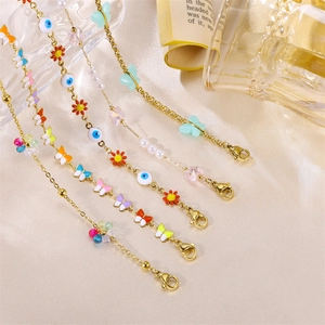 Elegant gold-plated chain bracelets with colorful enamel butterflies and evil eye beads