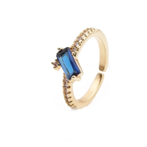 18K gold plated ring with blue rectangular zircon and pavé stones on white background