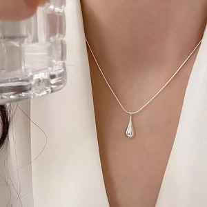 Minimalist S925 sterling silver waterdrop pendant necklace on a sleek snake chain