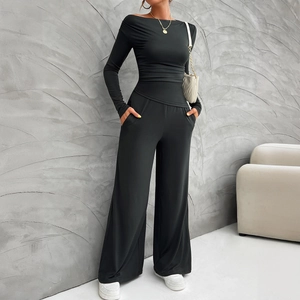 Women's chic black two-piece set featuring off-shoulder long sleeve top and wide-leg pants