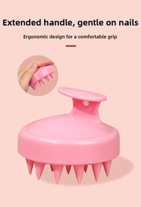 Pink scalp massage brush featuring a long ergonomic handle and soft silicone bristles