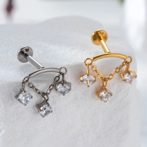 F136 titanium silver and gold chain earrings with zircon studs on white background
