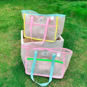 Colorful mesh tote bags for beach and travel in vibrant color-block summer designs