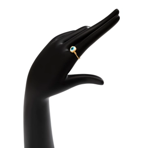 Detailed view of handmade gold wire evil eye ring featuring blue enamel gemstone