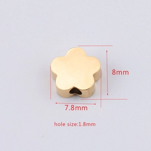 Macro shot of 8mm gold flower bead detail showing 1.8mm hole size for jewelry making
