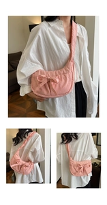 Detailed views of the pink crescent shoulder bag with a large decorative bow and strap