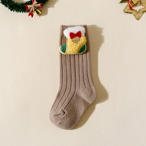 Detailed view of kids knit Christmas sock with plush stocking charm and festive decor