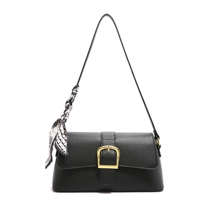 Elegant black faux leather shoulder bag with gold buckle and silk scarf detail