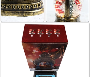 Detailed views of bronze Christmas lantern snow globe showing base and packaging