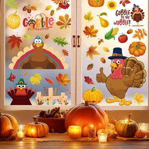Detail of Thanksgiving window clings with turkeys and pumpkins on a glass window