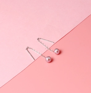 Detail shot of pink freshwater pearl drop earrings with S925 sterling silver chain