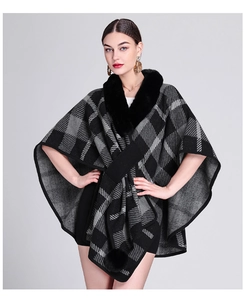 Detail of faux rabbit fur collar and plaid knit pattern on women's winter poncho wrap