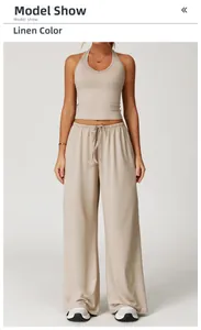 Beige two-piece sports yoga set with halter top and wide-leg pants for fitness wear