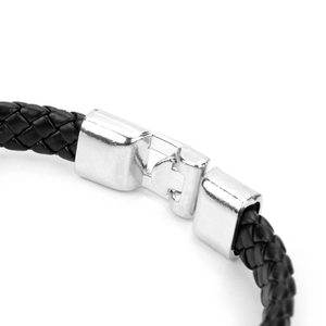 Detailed view of silver metal clasp on black braided leather bracelet for men